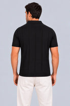 Camisa Mallorca negra, polo de punto con ruedo acanalado, vista posterior